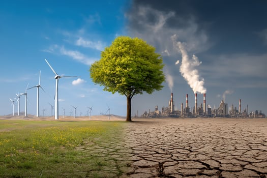 Contrasting scene showing green field on one side and barren land on the other photo