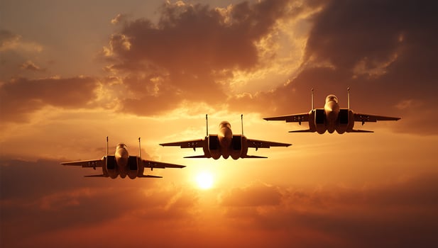 Three fighter jets fly in formation against a sunset sky with striking clouds photo