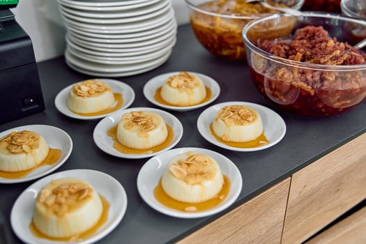 A Delicious Array of Creamy Desserts Showcasing Flans with Caramel Sauce and Almond Toppings, Perfect for Any Celebration or Gathering photo