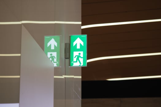 Emergency exit sign illuminated in a modern interior photo
