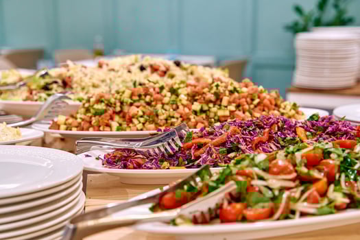 A Colorful Array of Fresh Salads and Vibrant Dishes Displayed on a Buffet Table, Showcasing a Diversity of Ingredients and Flavors photo