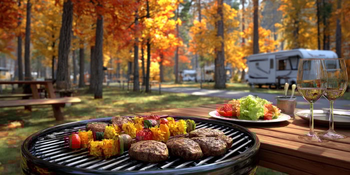Family autumn BBQ in a forest RV park. Vacation, food, relax, togetherness photo