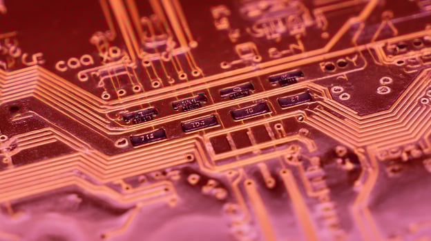 Close Up View of a Red Circuit Board with Detailed Components and Connections. photo