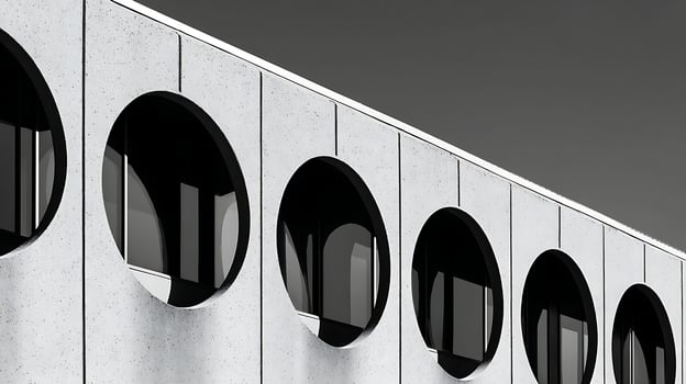 Modern Building with Circular Window Patterns on Textured Wall. photo