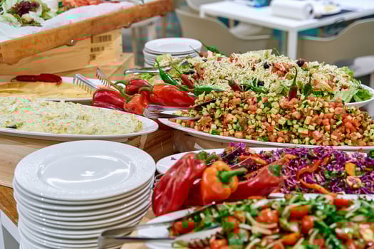 A Colorful Display of Fresh Salads and Vegetables at a Festive Gathering, Showcasing a Variety of Ingredients and Vibrant Flavors on Elegant Serving Dishes photo