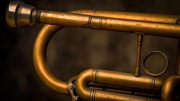 Vintage golden trumpet detail showing aged brass and intricate design. photo