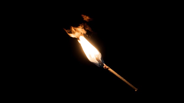 Bright Torch Flame Burns in the Dark for Guidance and Hope. photo