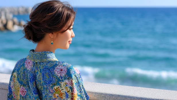 Lady enjoying sea view at beach on sunny day. Vacation or tourism background photo