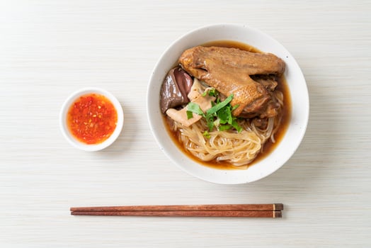 Braised duck noodles with brown soup in Asian food style photo