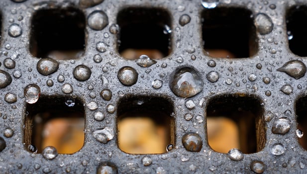 Water drops on a drain grate photo