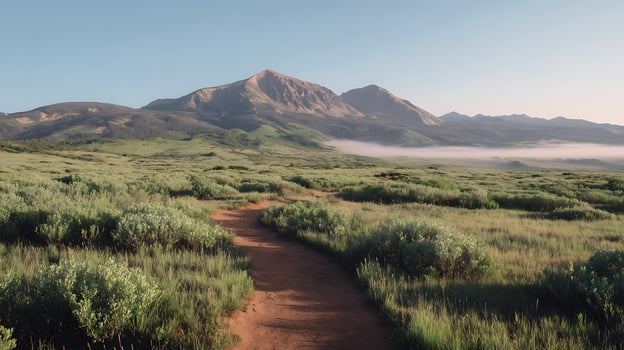 Scenic Mountain Trail Through Misty Green Plains at Sunrise. photo