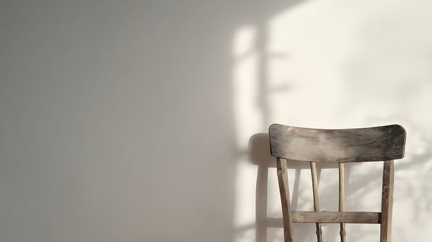 Vintage Wooden Chair Bathed in Soft Natural Light with Shadow Patterns. photo