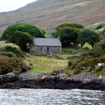 Remote Stone Cottage Nestled by the Sea and Rolling Hills. photo