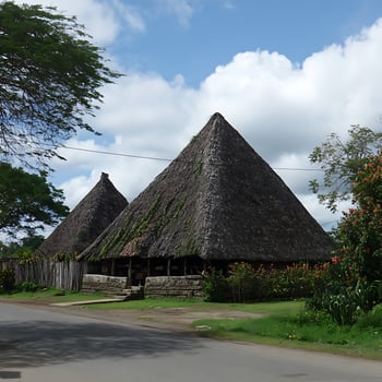 Traditional Thatched Roof Houses Nestled Amidst Tropical Greenery. photo