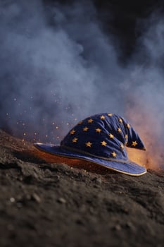 Wizard hat on mound in smoke. Fantasy, magical, Halloween, creative use photo