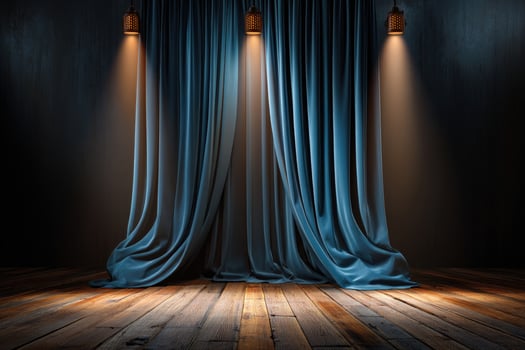 Stage with blue curtains illuminated by spotlights on a wood floor creates drama photo