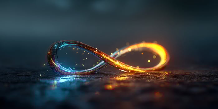Infinity symbol with blue and orange glow on a textured surface with light reflections photo