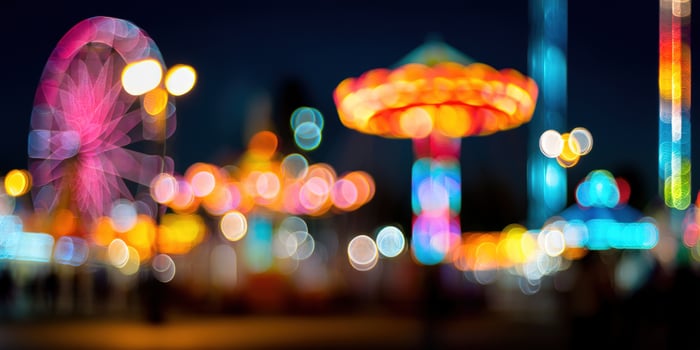 Festive rides sparkle. Bright lights dance in blurry bokeh at nighttime carnival photo