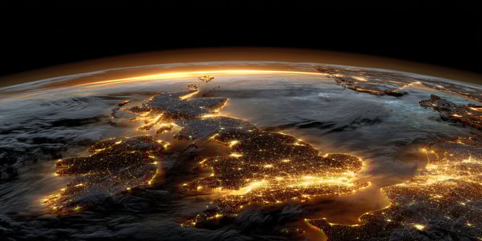 City lights in UK view from space. Coast, sunset horizon, global connection photo
