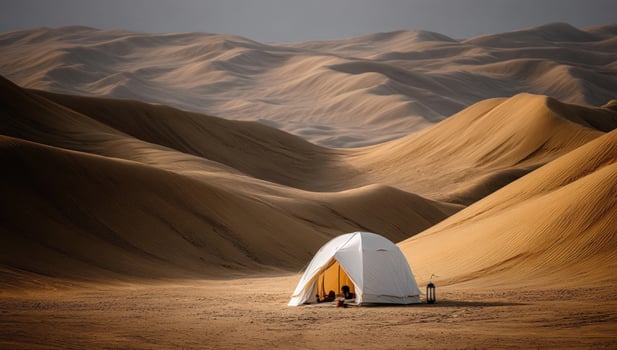 Desert tent camping under vast dunes in summer heat. Adventure travel usage photo