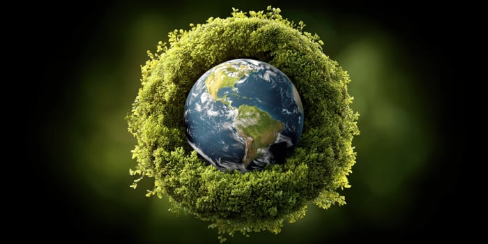 Earth, planet covered with foliage, symbolises world environment in background photo