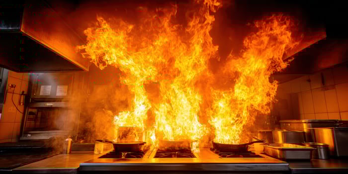 A kitchen with flames coming out of it photo