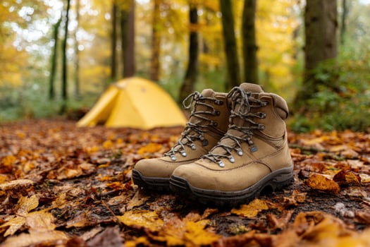 Hiking boots on foliage, camping in woodland, recreation, nature travel photo