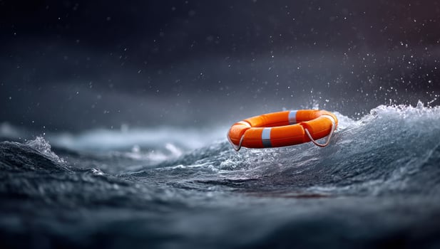 Lifebuoy floats on a turbulent sea during a storm as a rescue hope symbol photo