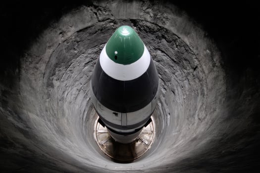 Missile in concrete silo, top view, preparing to launch. Underground base photo