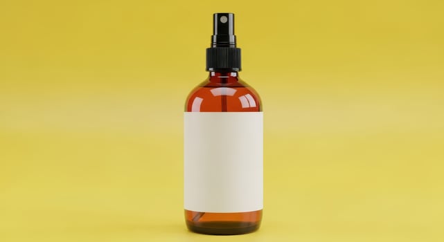 Amber glass spray bottle with blank label on yellow background photo