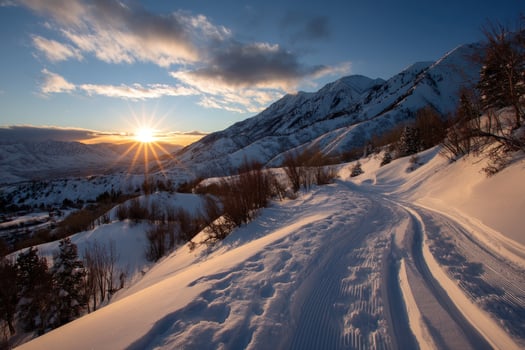 Winter wonderland Sunlight brightens snow-covered mountains and winding trail photo