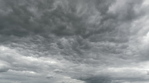 A Dramatic Gray Cloudy Sky that Displays Textured Clouds in an Artistic and Atmospheric Scene Time lapse. photo