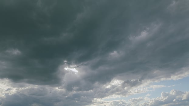 An Incredible and Dramatic Cloud Formation with Intermittent Rays of Sunlight Peeking Through photo