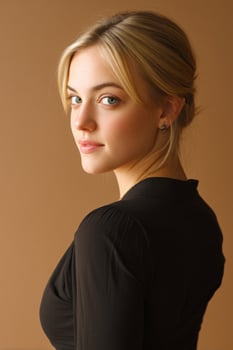 Attractive blonde woman in black shirt looking over shoulder. Simple background photo