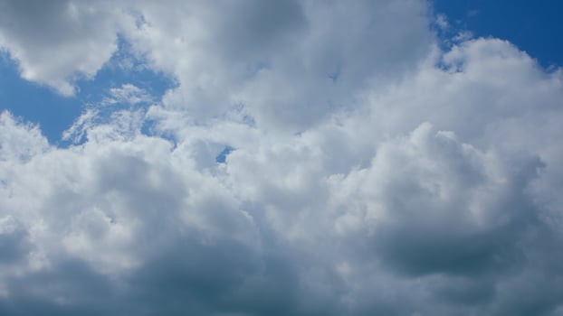 Experience the Dynamic and EverChanging Clouds in a Beautiful Blue Sky Above You photo