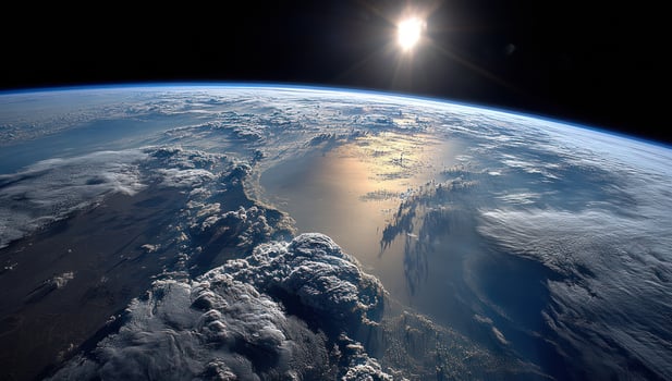 Earth view from space showing clouds over blue ocean and sun in background photo