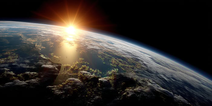 Earth's sunrise seen from space showing clouds and planet curvature and sunrays photo