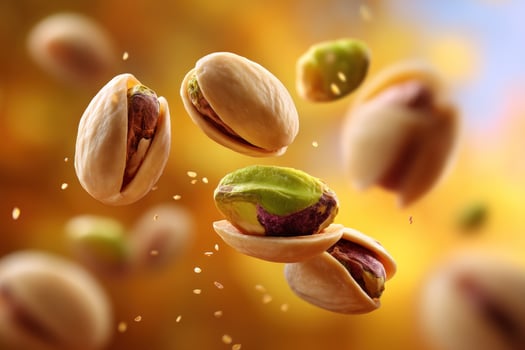 Pistachios levitating, closeup view, bright studio background, advertisement use photo