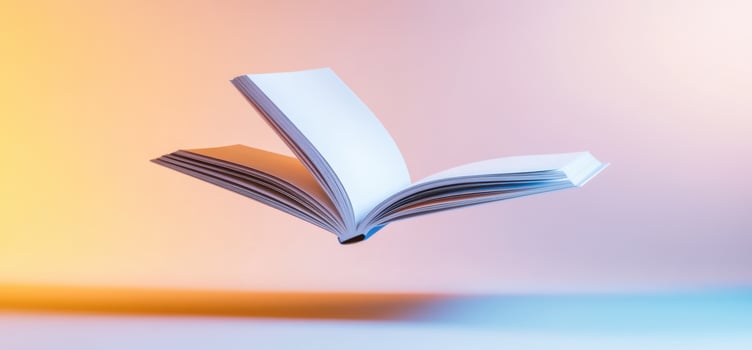 A floating open book against a colorful gradient background, symbolizing knowledge photo