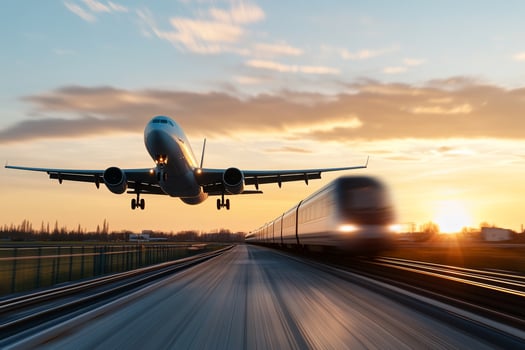 Airplane Landing Over Train Tracks at Sunset with Motion Blur Background photo