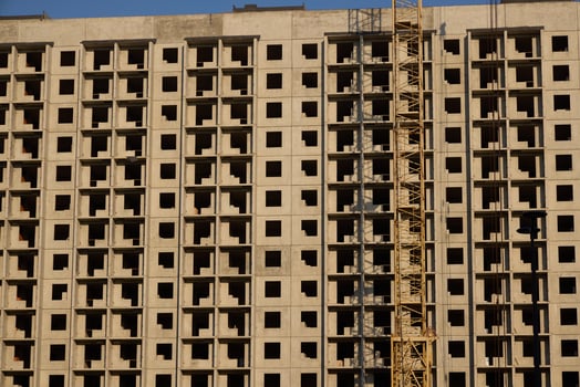A bustling urban construction site featuring a prominently built concrete structure photo