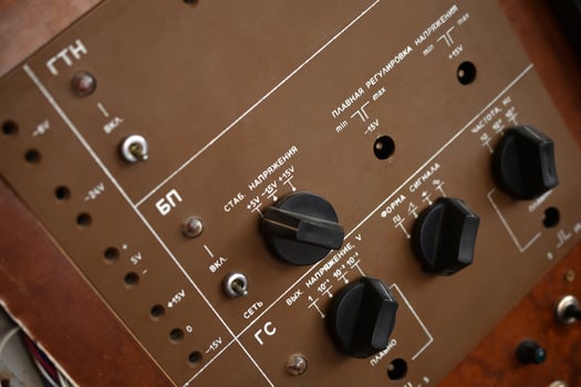 Close-up of old toggle switches on a dusty control board. Vintage hardware from early electrical systems. photo