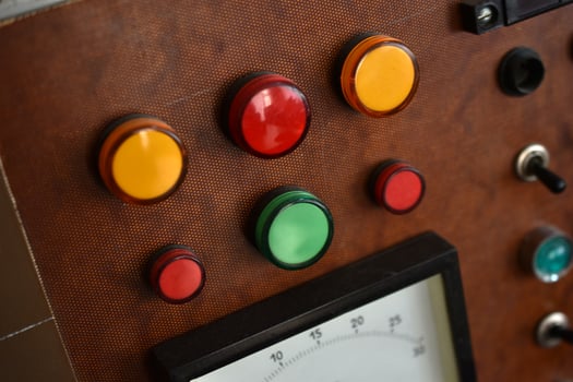 Vintage relay control panel with switches and indicator lamps. Industrial electronics used in early automation systems. photo