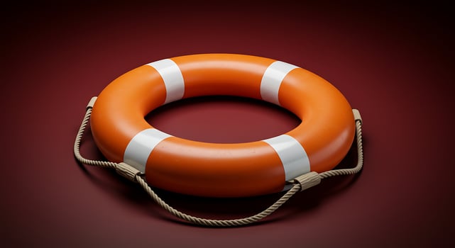 Dramatic Still Life of an Orange Lifebuoy on a Rich Burgundy Background photo