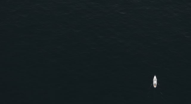 A boat is sailing in the ocean photo