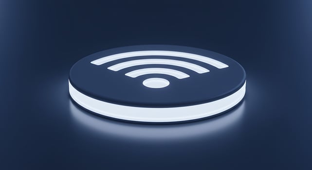 Sleek 3D Wi-Fi Symbol Glowing with White Light on a Reflective Dark Blue Surface photo