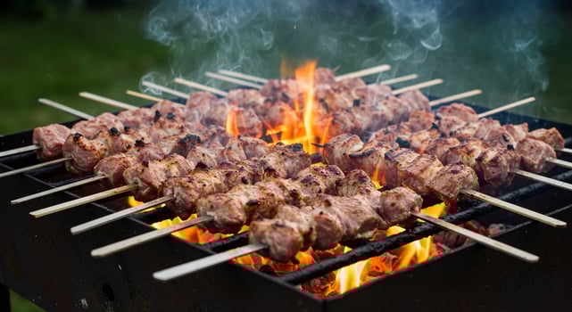 Sizzling Shashlik Skewers Grilling Over Fiery Coals and Open Flames photo