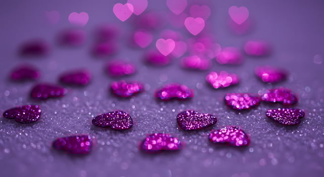 Purple hearts on a purple background photo