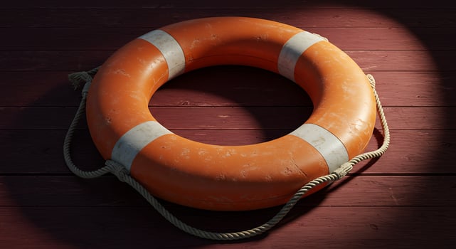 An orange life preserver on a wooden floor photo