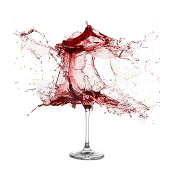 Explosion of a glass with red wine photo